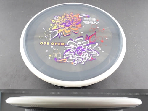 Disc golf disc with floral design.