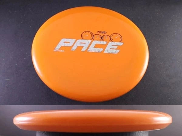 Orange disc golf disc with PACE printed on it.