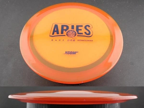 Orange and yellow Aries disc golf disc.