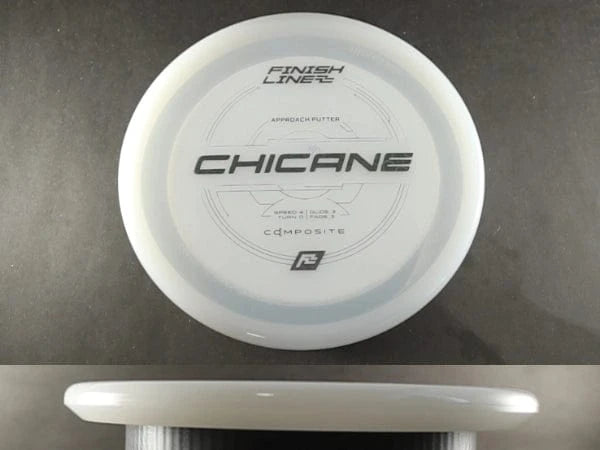 White disc golf disc labeled CHICANE.