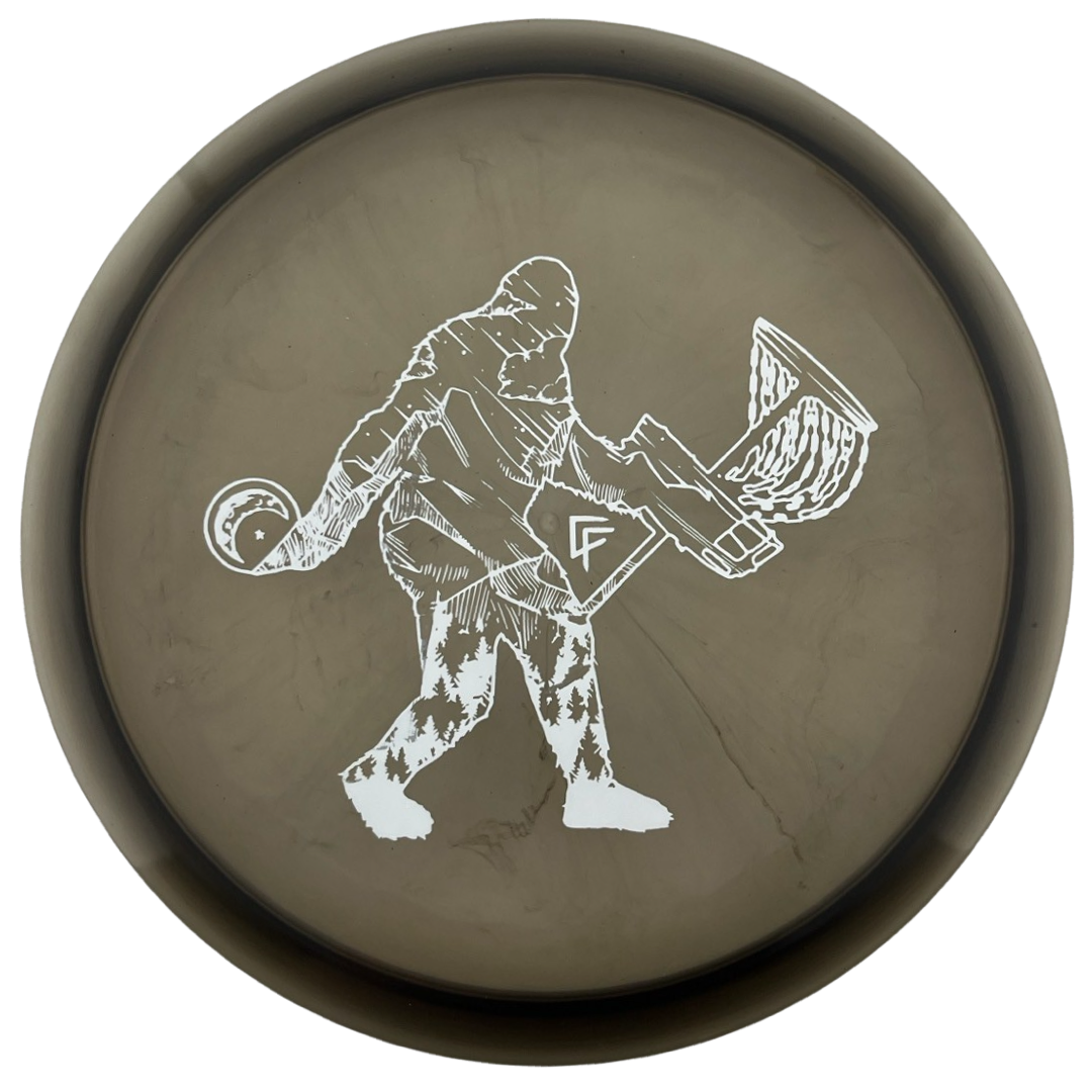 Midnight Z Buzzz disc with Bigfoot & disc golf basket